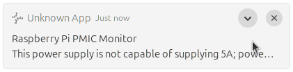 The desktop notification from earlier about the power supply, but now in the backlog tray with a truncated message and no action buttons. However, an expansion button is now present in the top right