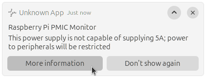 The desktop notification from earlier about the power supply, but expanded to show the full message, and the two action buttons, "More information" and "Don't show again"