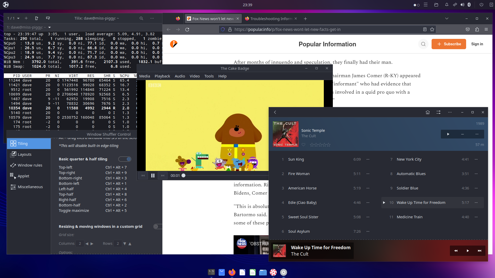 A screenshot of the Ubuntu Budgie desktop. Under the dark top bar containing the start-menu button, clock, and system tray, a variety of applications are shown including "top" running under the Tilix terminal, The Cult's "Sonic Template" album in the Lollypop music player, an episode of "Hey Duggee" playing in the Parole video player, and Firefox in the background showing a news article. At the bottom center of the screen is the MacOS X Dock-like application showing the icons of all the running applications, and a few others for quick launch.